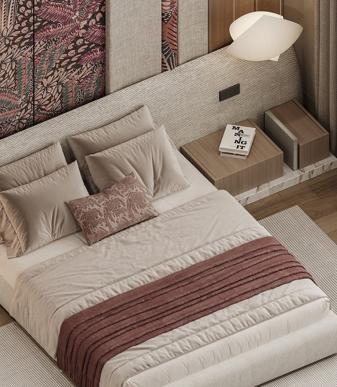 Bed detail with layered linen and a burgundy throw