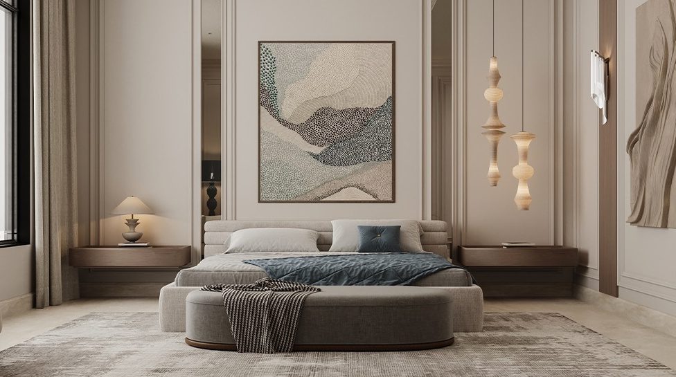 Master bedroom with rounded bed, abstract art and pendant lighting