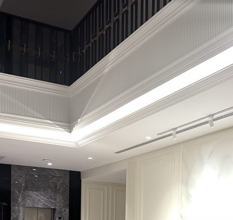 Double height majlis with linear lighting and marble